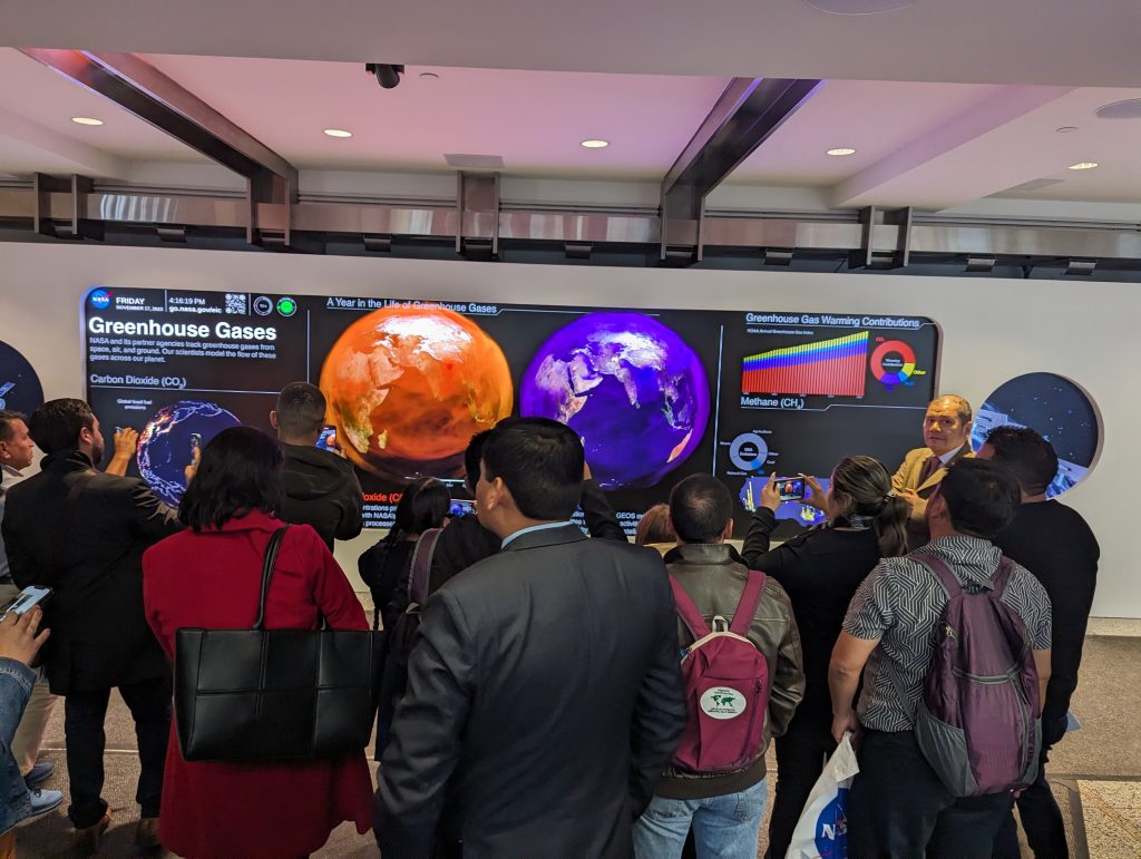 South American Leaders viewing the Greenhouse Gasses dashboard at the EIC hyperwall.